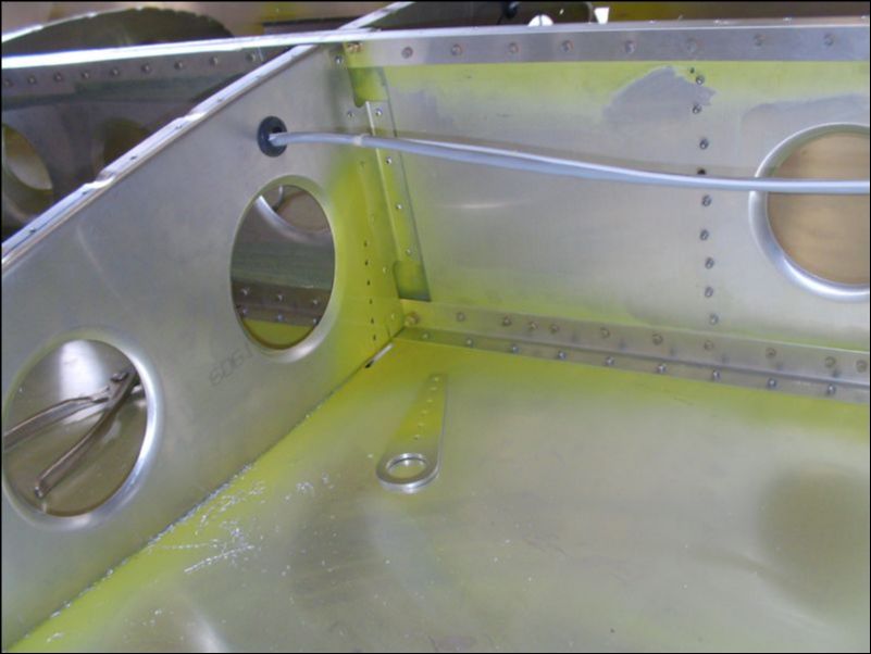 Deburr, clean, and prime tiedown and rib 9.