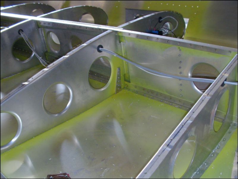 Rivet tiedown to rib 9.