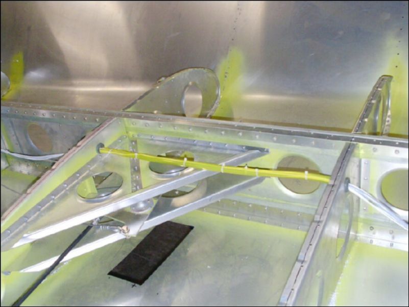 Install tube over wires in wing to protect them from rubbing on the bellcrank assembly