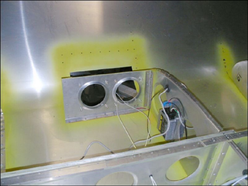 Rivet the landing light assembly to the right wing