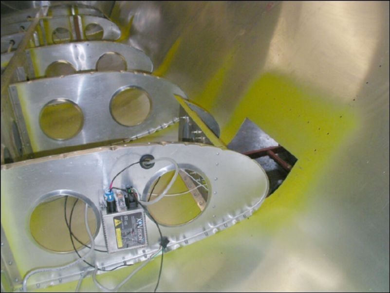 another view of the landing light assembly riveted to the right wing.