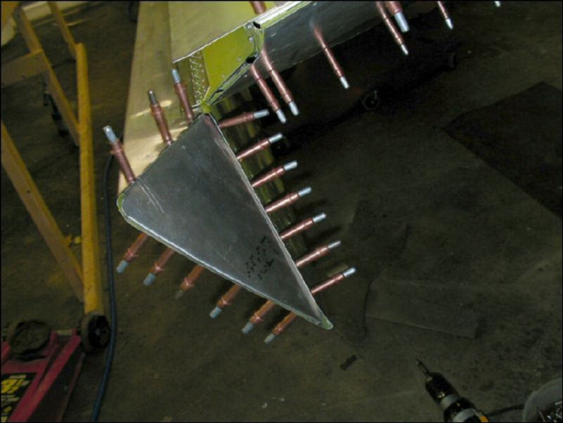 Cut aileron tip skin to fit the wing tip.  Form new aileron tip, drill and cleco in place.