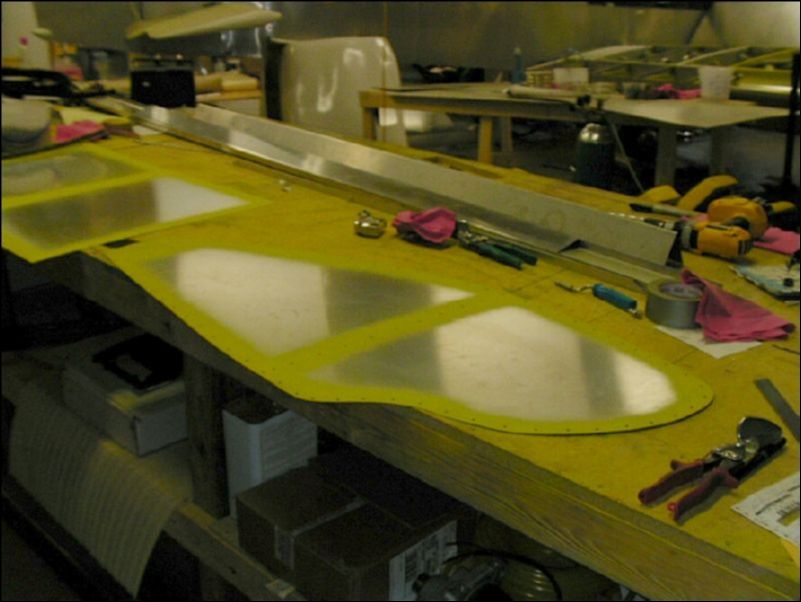 Deburr, clean, and prime wing tip skins.