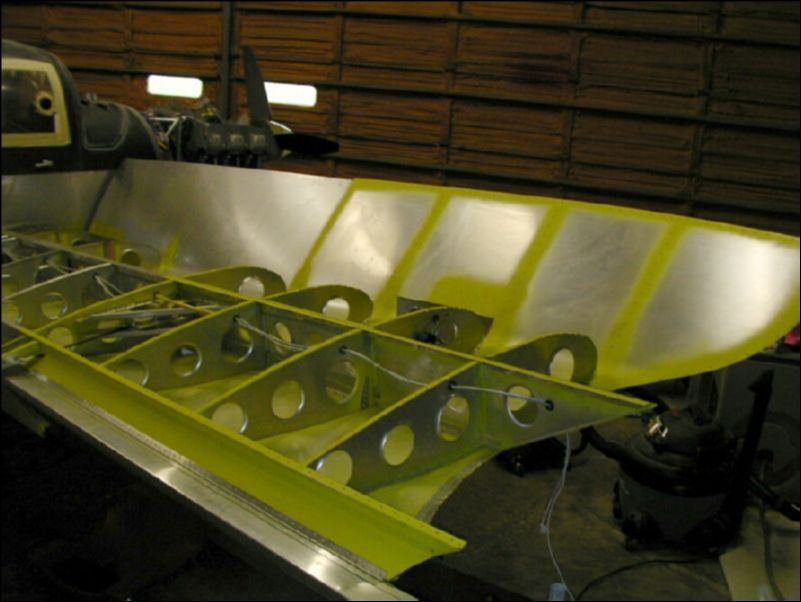 Deburr, clean, and prime wing area for tip skins.