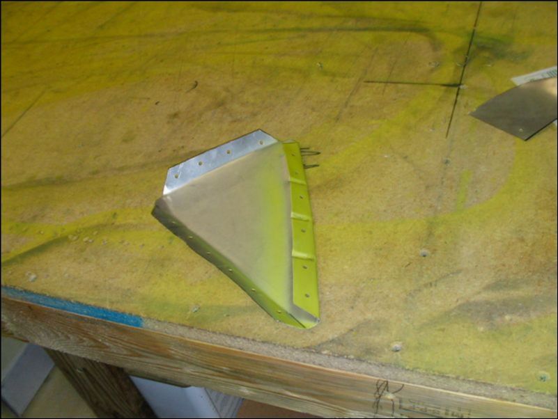 Deburr, clean, and prime aileron tip.