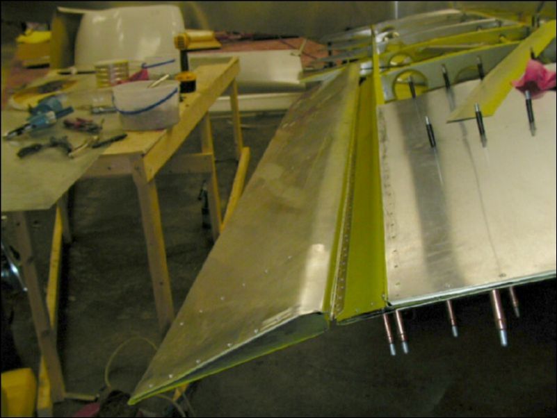 Rivet aileron tip and hinge.