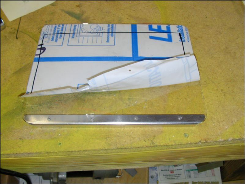 Cut landing light cover to fit wing and install stiffener to top of lense with flush mount rivets.