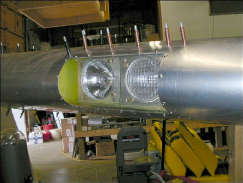 Install self tapping #6 screws to secure lense to wing.