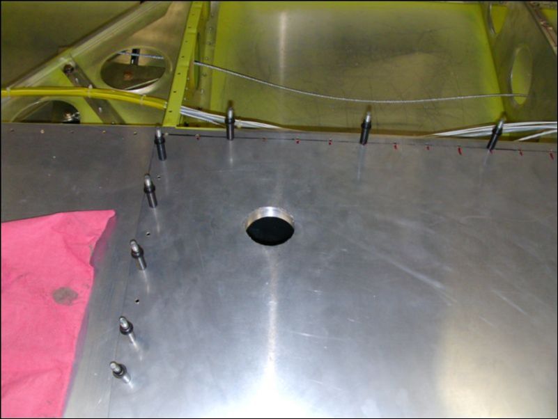 close the top skin to check hole location, trim as needed.